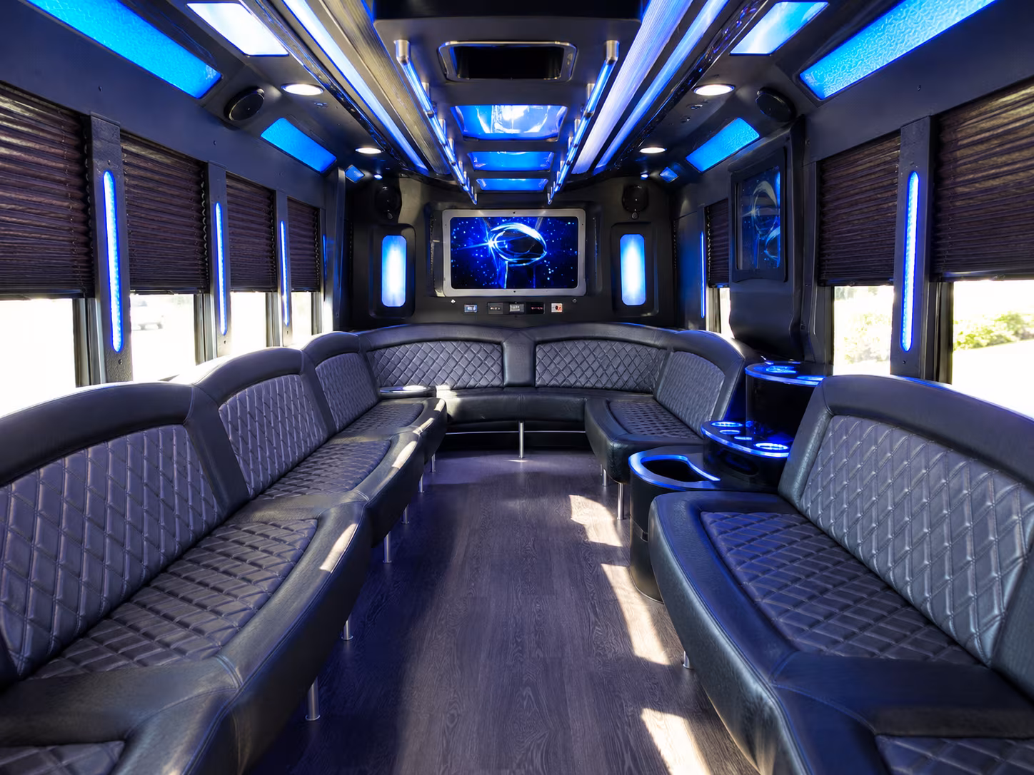 Group beside a Mercedes Sprinter limo in Warren